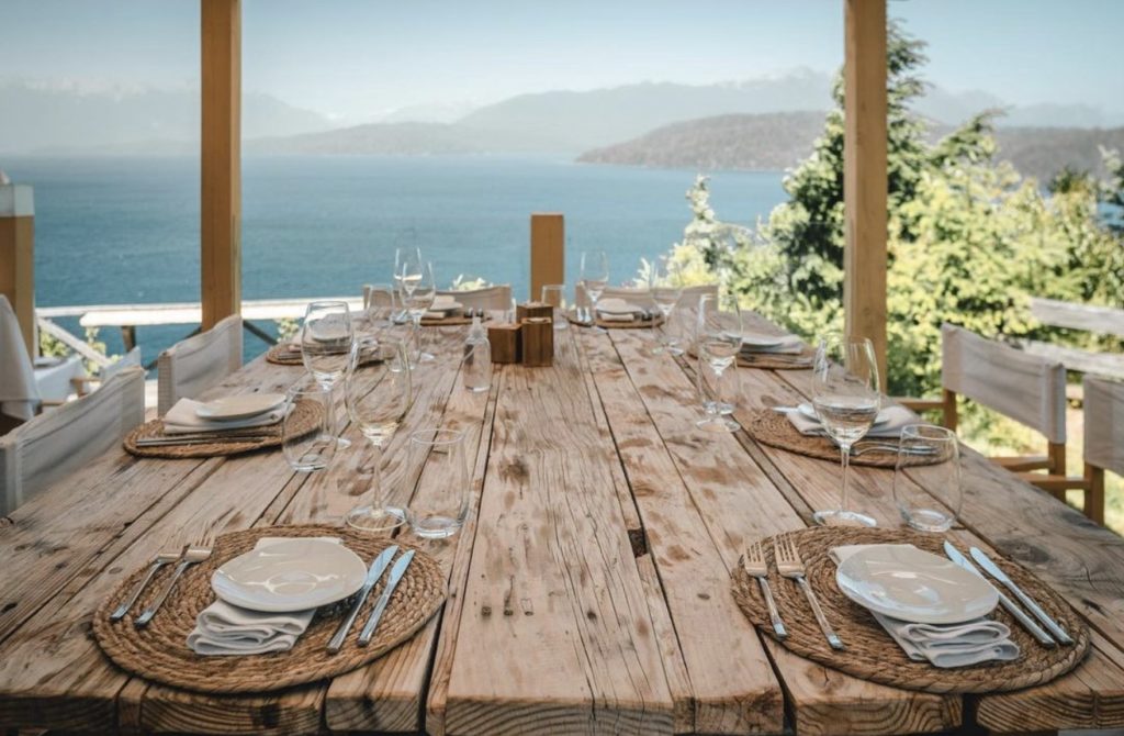 Mirador Social Club rustic dining table and view eat in villa la angostura
