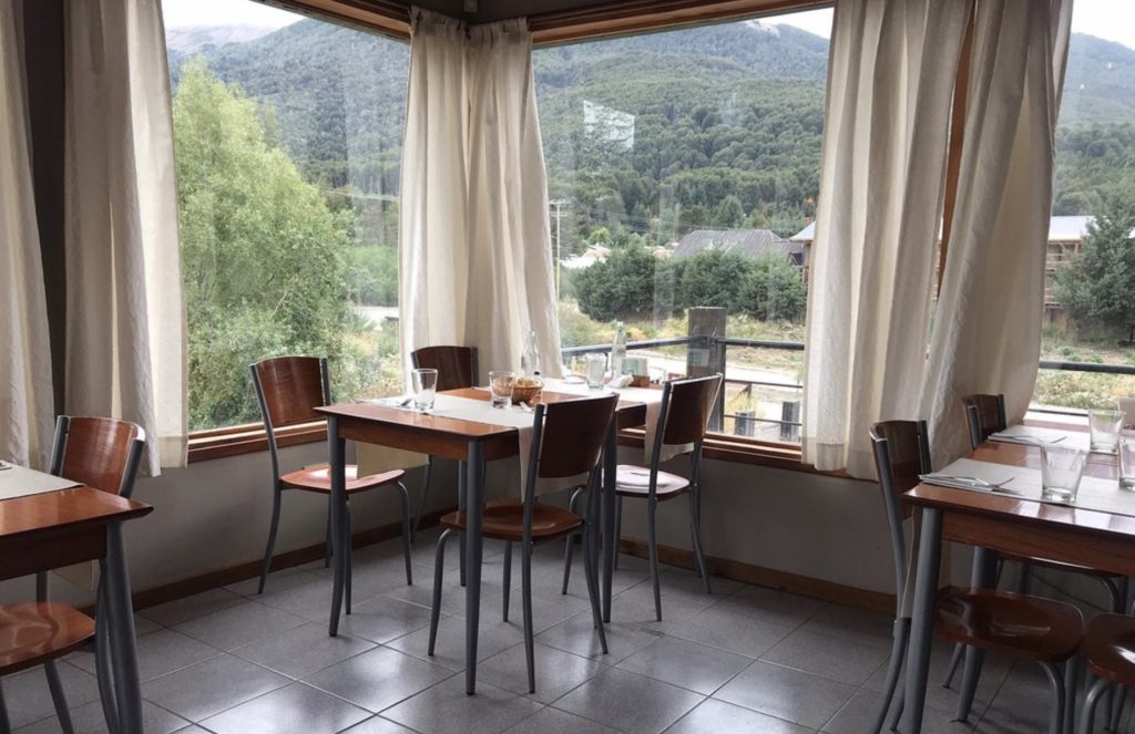 corner of restaurant dining room with windows eat in villa la angostura