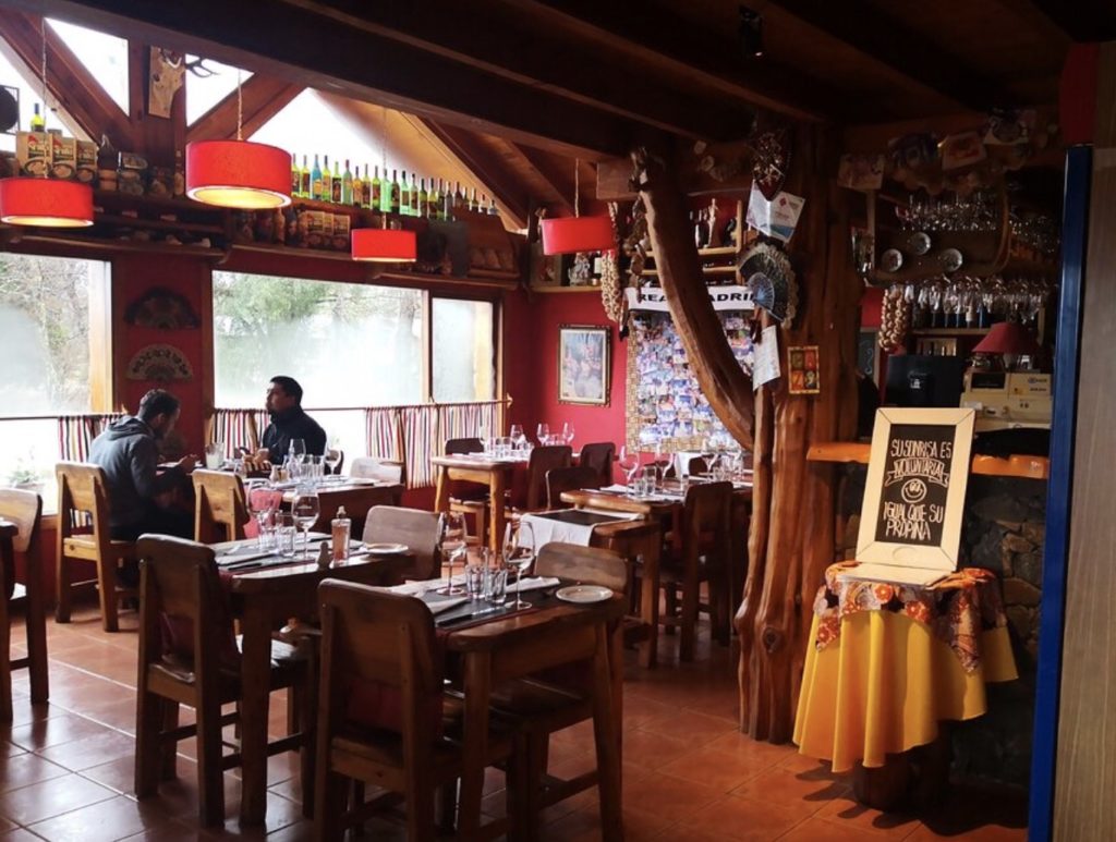 cozy wood dining room of argentine spanish restaurant eat in villa la angostura